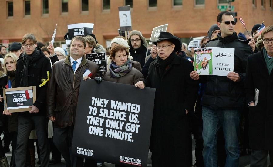 People gather for a silent march in Washington, D.C., on Sunday, Jan. 11, 2015, to honor those who died during three days of attacks in Paris. (Olivier Douliery/Abaca Press/TNS)