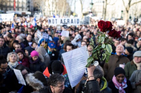 People holding cardboard signs reading '"Je suis Charlie" take part a unity rally in Paris on Sunday, Jan. 11, 2015, in tribute to the 17 victims of a three-day killing spree by homegrown Islamists. (Emeric Fohlen/NurPhoto/Zuma Press/TNS)