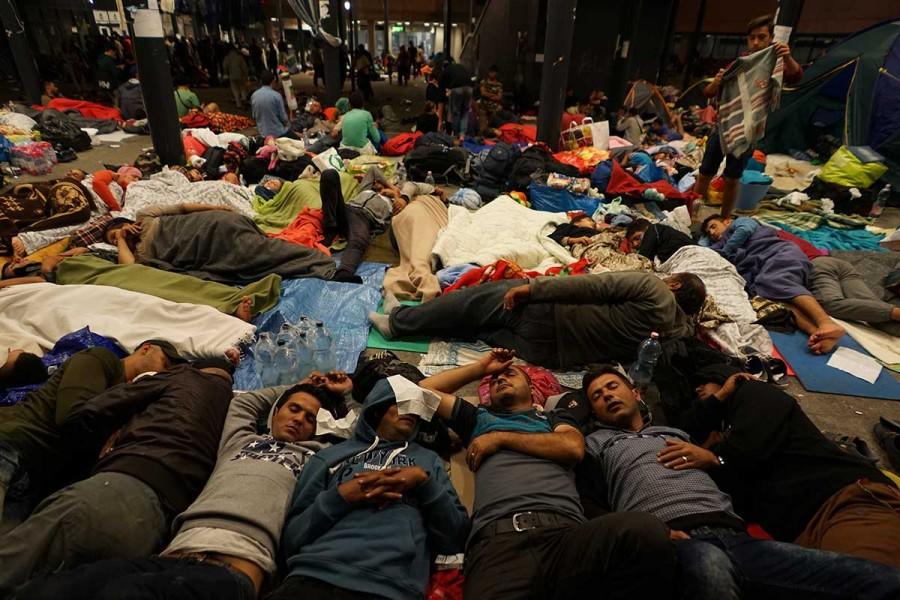Syrian refugees having rest at the floor of Keleti railway station. Refugee crisis. Budapest, Hungary, Central Europe, 5 September 2015.