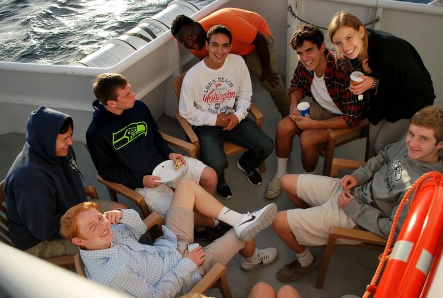 Seniors enjoy pop and sandwiches on the bow of the boat.