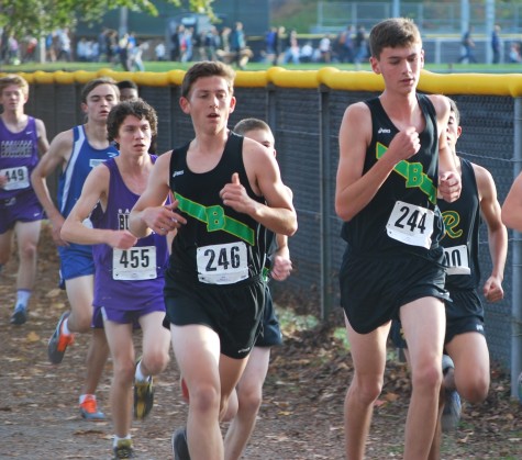 Perry (left) runs alongside of his good friend, Ben Hecko (right) at the Metro Championships in the JV heat. 