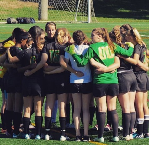 The team in a pre-game huddle.