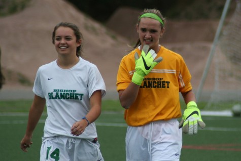 Sophomore, Molly Miska, and freshman, Sadie Kenny are all smiles during their season game.