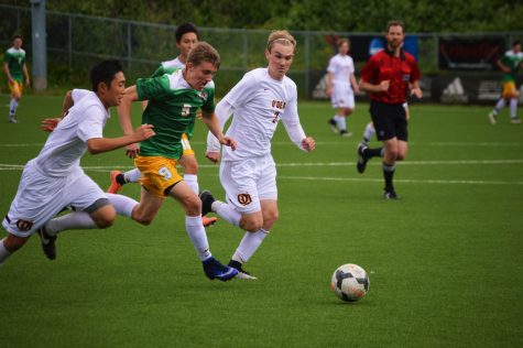 Captain Jake Kane working hard to keep the ball in his control