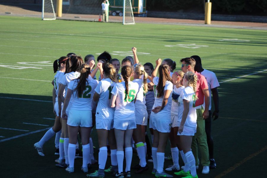 Team huddles pregame. Photo: Jimmy Rosenberger