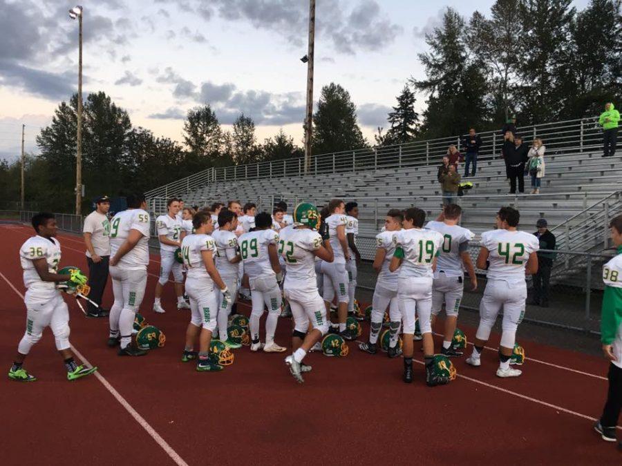 JV team gathers after Juanita win.