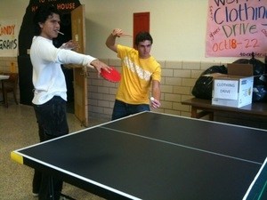 Students playing in doubles in the student lounge after school.
