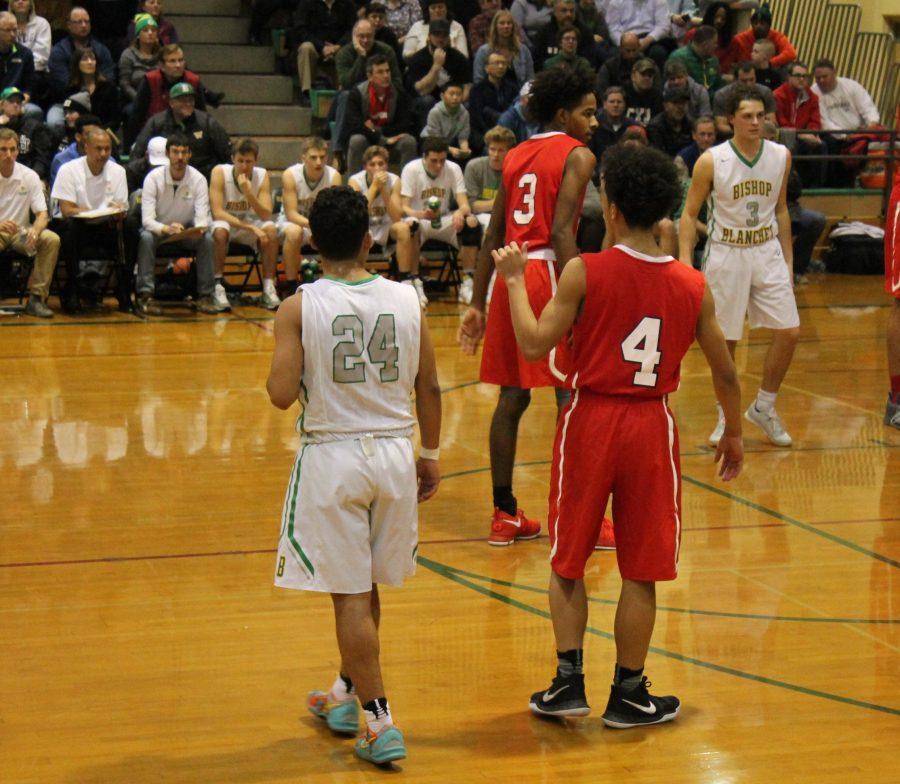 Carlos Rosales plays defense against Nathan Hale.