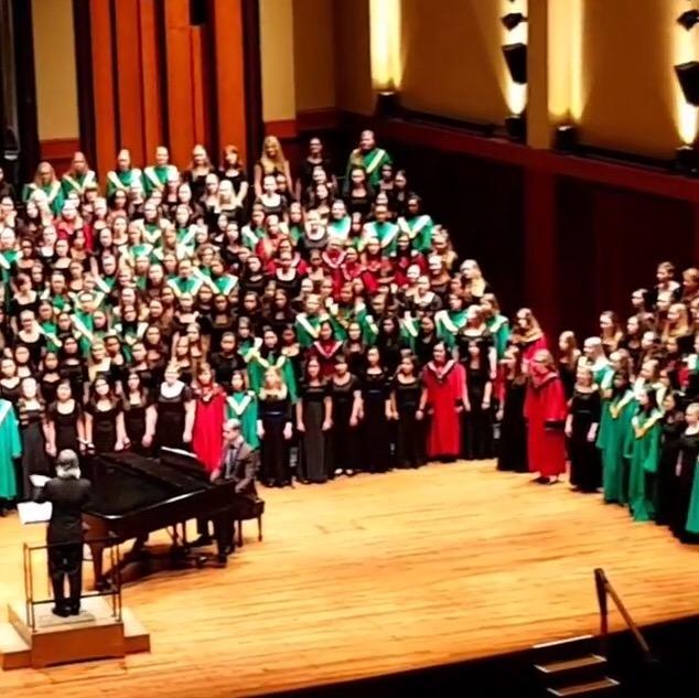 Vijay Singh conducts the girls choirs of all ten schools at the Festival of Catholic High School Choirs at Benaroya Hall.