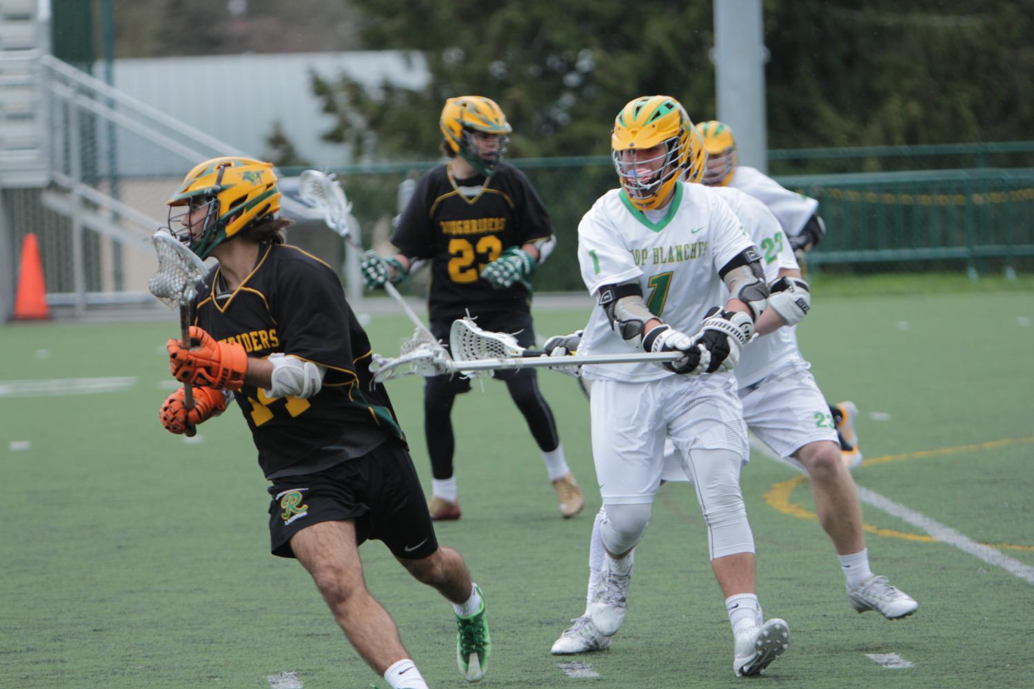 Senior defender Stephanos Bueller applies tough D to the Roosevelt Attacker.