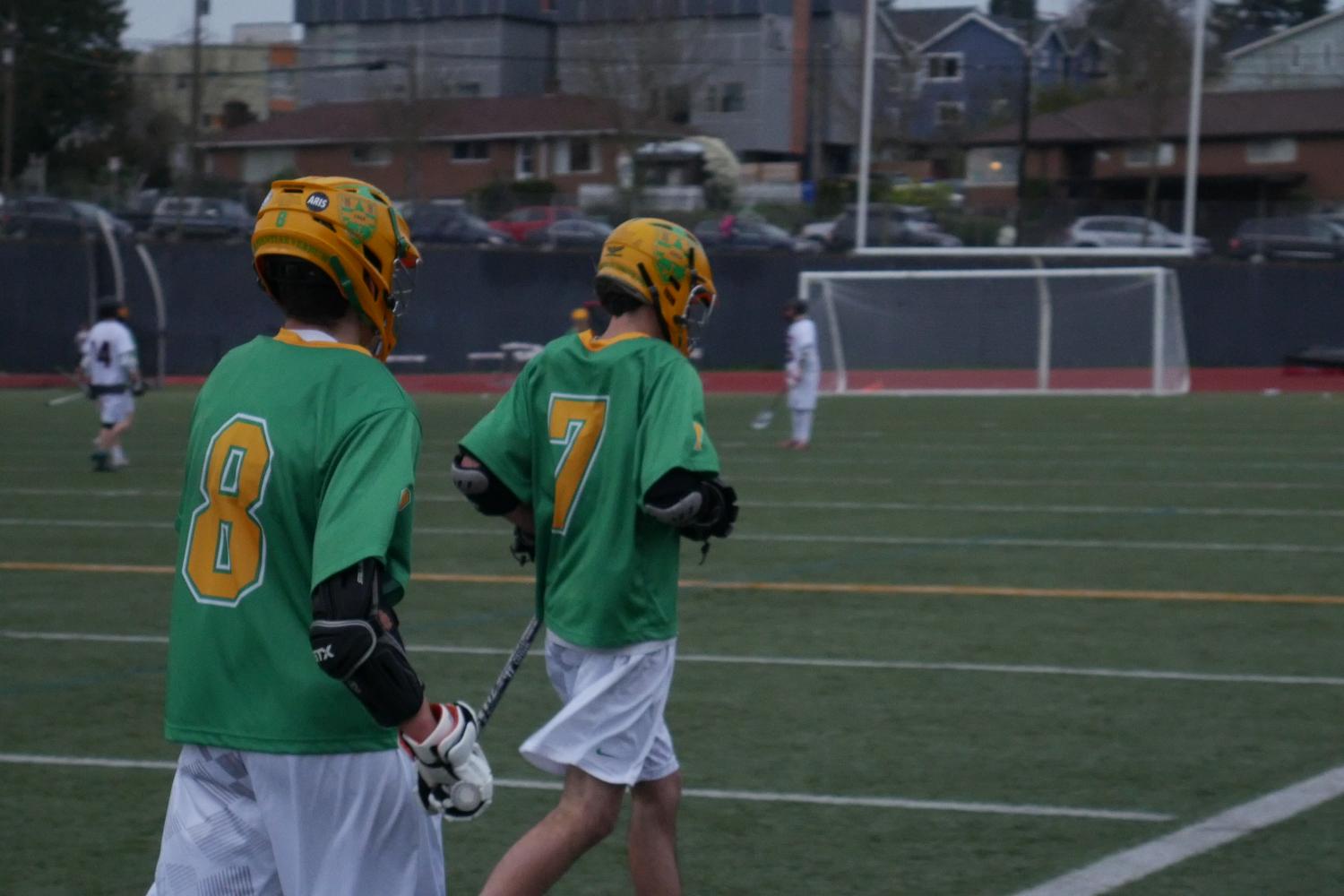 Jackson Brown (7) and Colin Curran (8) leave the field at halftime in a game against Ballard.