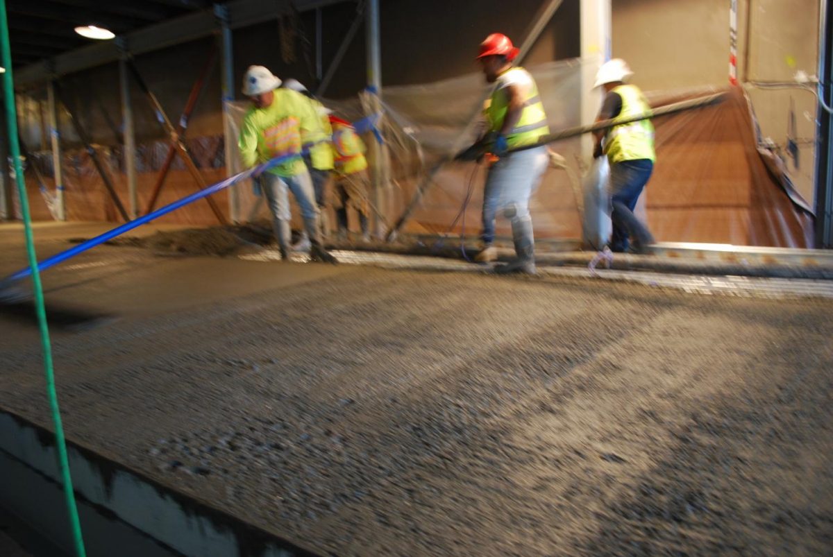 On August 17th,  facing an eminent strike by concrete workers, this crew manages to pour and finish the floor  of the cardio and trainers rooms.  this area extends of the stage in the main gym.