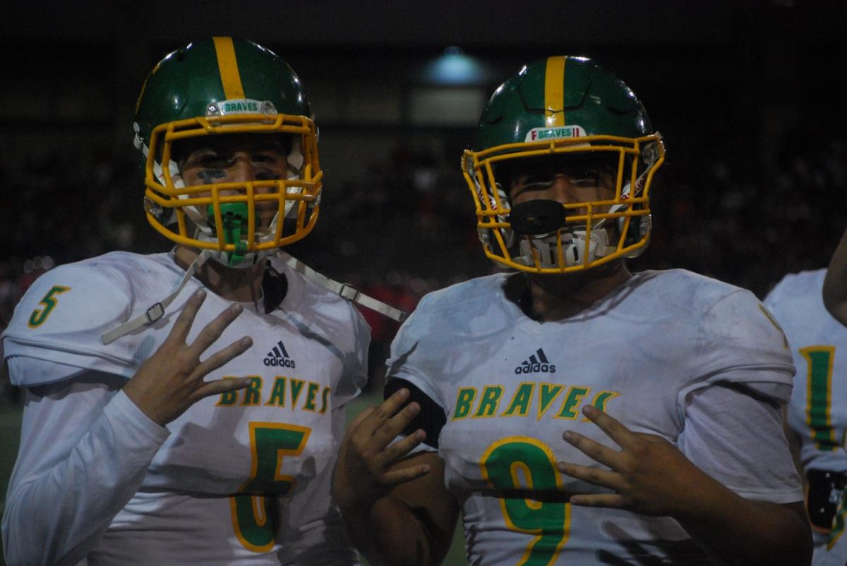 Parker Jonas (left) and Justin Brown (right) pose for a picture after their win against Juanita at their field in Bothell.