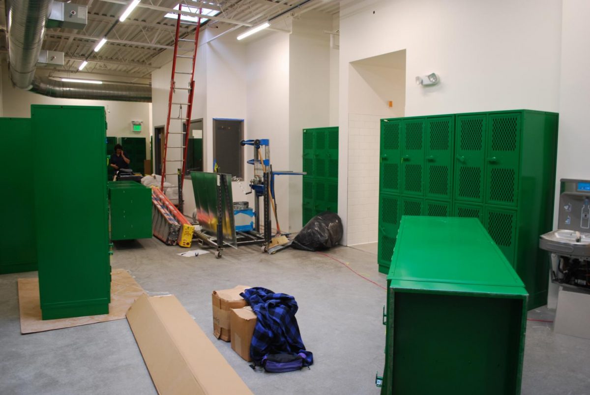 Saturday crews work to stay on target for the October 11th deadline.  This crew looks like it is playing Tetris, getting all of the locker to fit in the girls locker room.