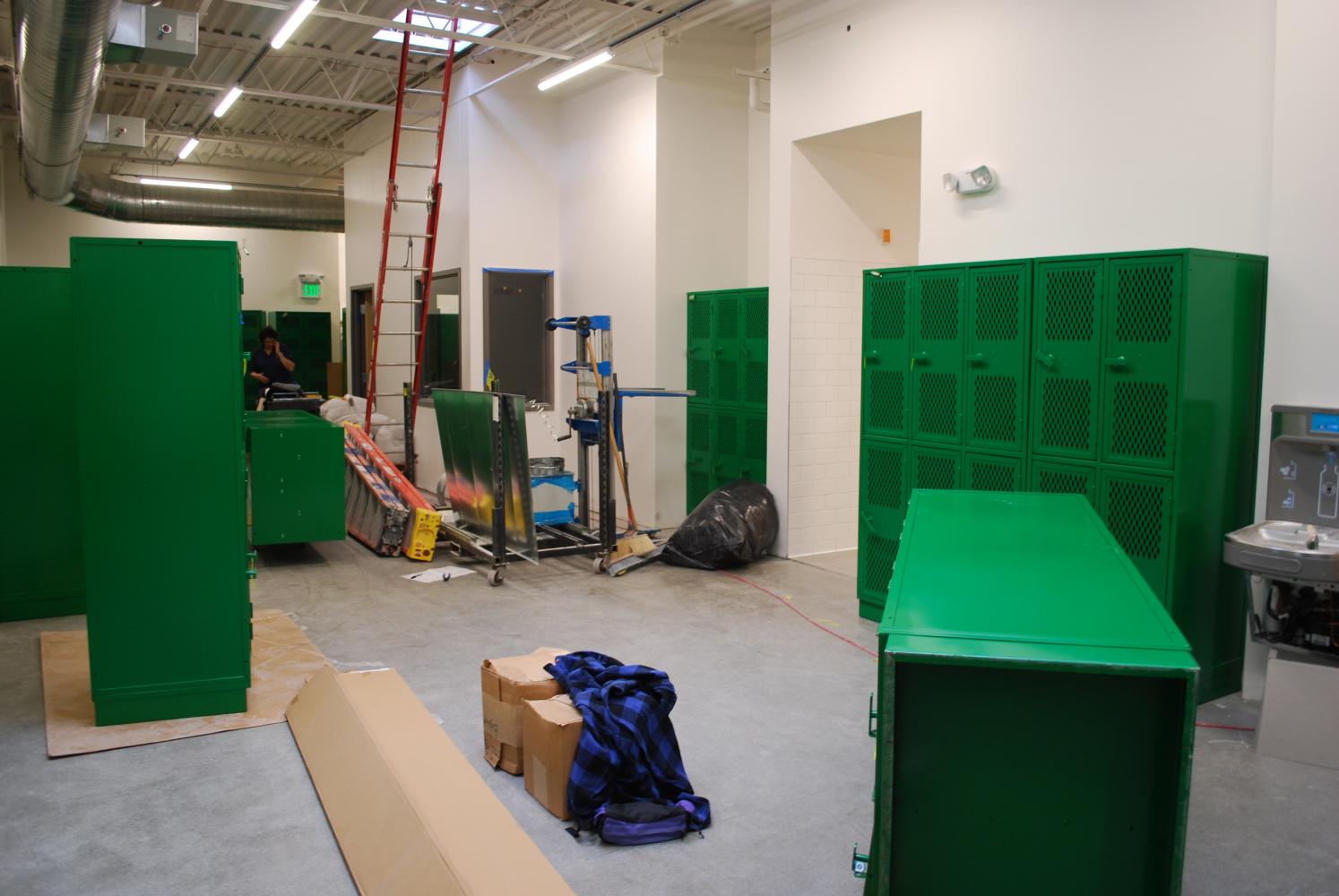 Saturday crews work to stay on target for the October 11th deadline. This crew looks like it is playing Tetris, getting all of the locker to fit in the girl's locker room.
