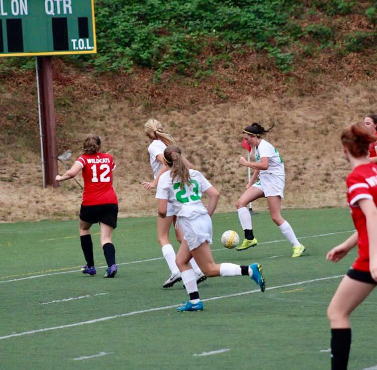 Sarah King mixing defenders to score a goal. 