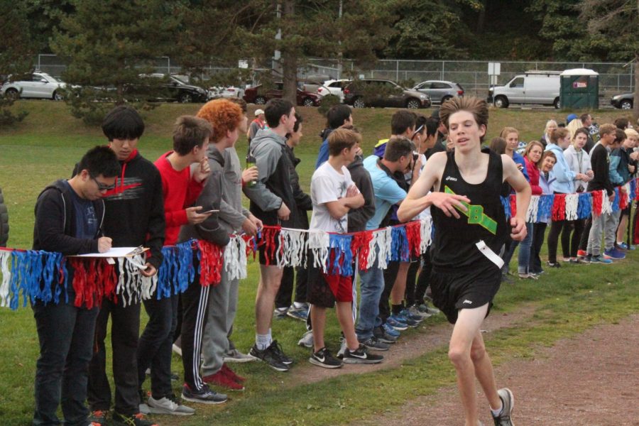 Drew Schornak, an avid participant in winter training, is seen here running down the chute to the finish line during his 2017 cross country season. 