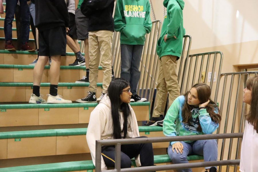 Freshman Christine Cainglet and Emma Butler discussing at the MLK assembly.