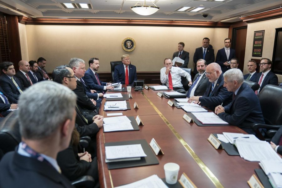 President Donald J. Trump, joined by Secretary of Health and Human Services Alex Azar and White House Chief of Staff Mick Mulvaney, listens as Dr. Robert R. Redfield, Director of the Centers for Disease Control and Prevention, addresses a briefing on the latest information about the Coronavirus Wednesday, Jan. 29, 2020, in the Situation Room of the White House. (