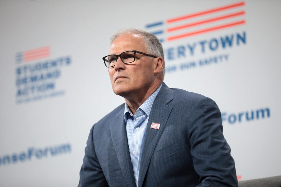 Washingtons Governor Jay Inslee speaking in front of a press