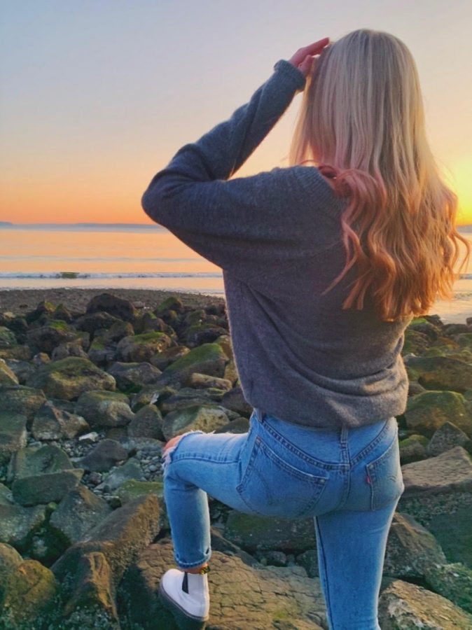 Seattle Prep senior showcases her pink hair at sunset. 