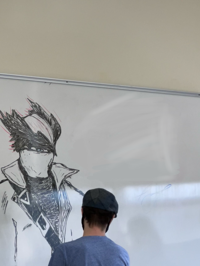 Andre Derickson working on a drawing on The Living White Board