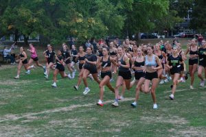 SPRINTING INTO THE SEASON: Members of the cross country team sprint away from the starting line by the Green Lake wading pool. “It was super fun to see everyone supporting each other and an amazing opportunity to get my name on the board!” said Ella Muhm '28, girls third-place finisher.
