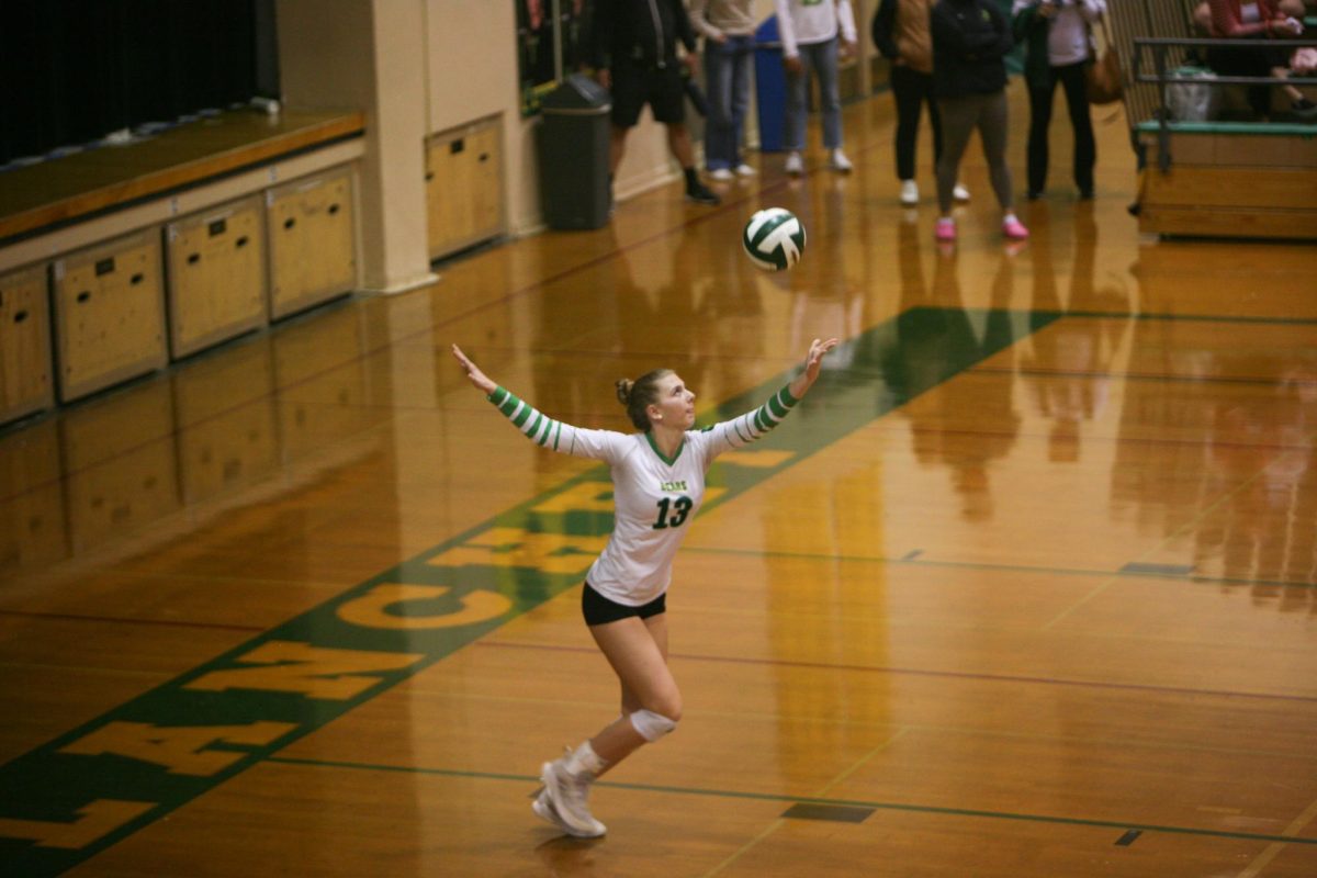 SEALING THE SET: Blanchet Sophomore Clara Kane delivers a strong serve during the third set.